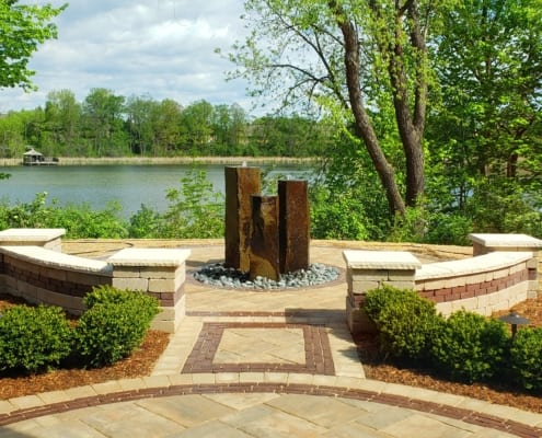 Paved patio with water feature